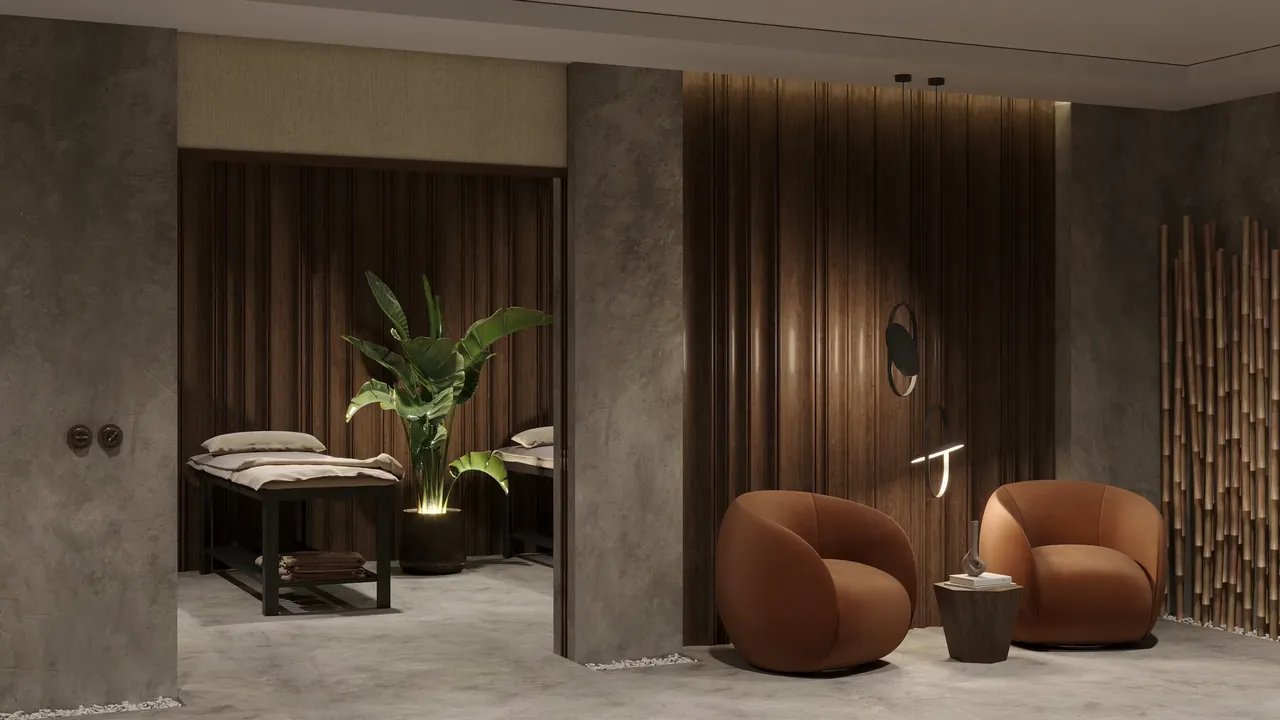 Warm, elegant spa interior with a massage bed and relaxing seating at Soni Daynight Spa, Prayagraj